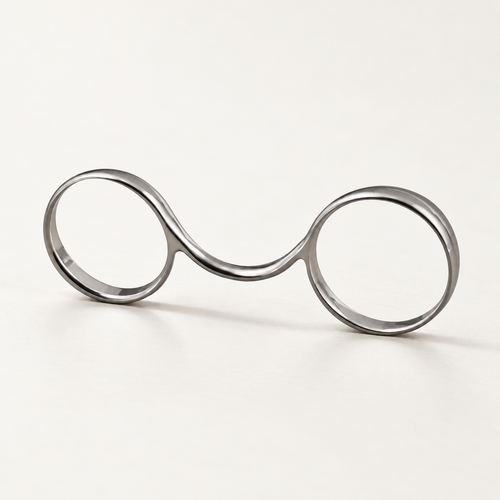 2½ buddy ring in polished silver-tone metal with two loops joined by a curved bridge, studio view