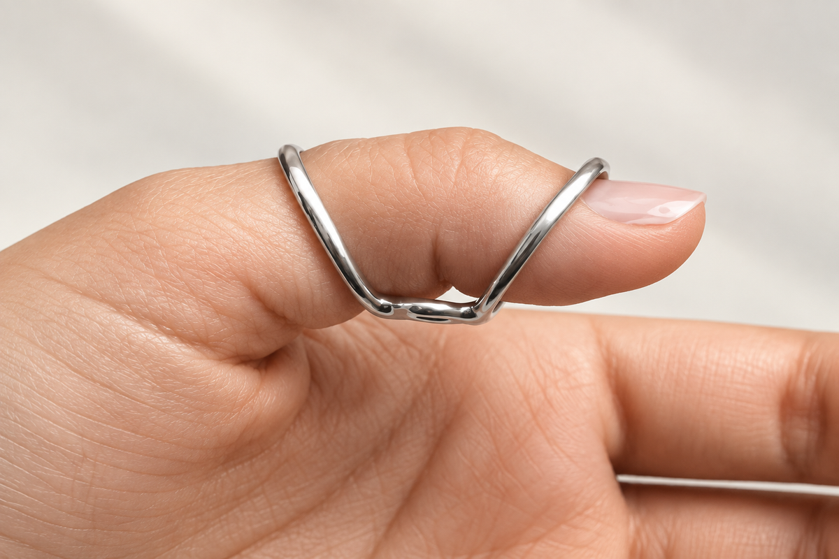 Boutonniere finger splint worn on a finger, angled view from the fingertip side