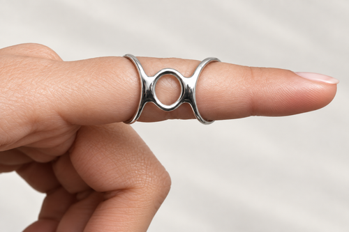 Boutonniere finger splint worn on a finger, front view showing the center loop over the joint