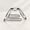 Boutonniere lateral support splint in polished silver-tone metal with a top ring and open ladder-style side frame, studio view