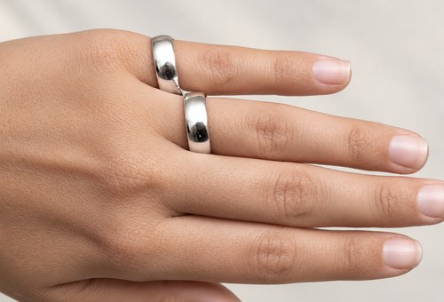 Buddy ring worn across two adjacent fingers