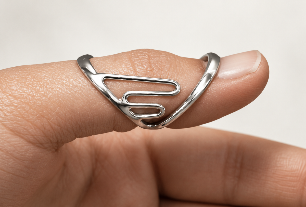 Lateral support finger splint worn on a finger, close-up of the open frame
