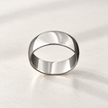 Pulley ring in polished silver-tone metal, a wide smooth band, studio view