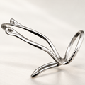 Thumb MCP splint in polished silver-tone metal with a V-shaped wire form and a looped end, studio view